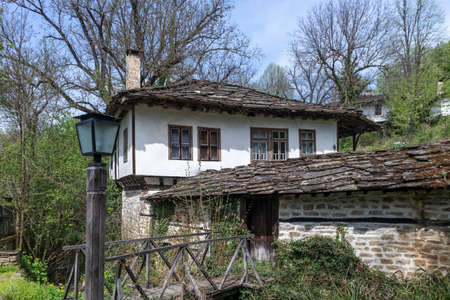 BOZHENTSI, BULGARIA - MAY 3, 2021: Typical street and old houses at historical village of Bozhentsi, Gabrovo region, Bulgariaのeditorial素材