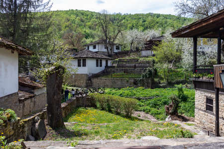BOZHENTSI, BULGARIA - MAY 3, 2021: Typical street and old houses at historical village of Bozhentsi, Gabrovo region, Bulgariaのeditorial素材