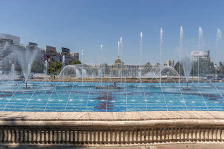 BUCHAREST, ROMANIA - AUGUST 17, 2021: Fountain at Unirii Square at the center of city of Bucharest, Romaniaのeditorial素材
