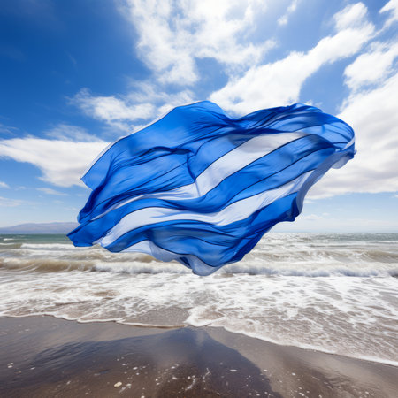 White and blue light fabric floats in the wind on the beach. The concept of freedom, independence. Seascape with large foamy waves on a windy day with brown sand on the shore and blue sky above in bright sunlight. Digital illustration. Abstract seascape.の素材
