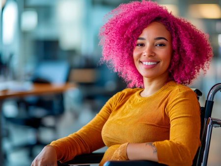 Colleague in a bright office smiles warmly, showing inclusivity and positivity in a dynamic workplace.の素材