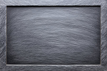 This black chalkboard background is clean and empty, ideal for teachers and artists to showcase lessons or creative ideas in any setting.の素材