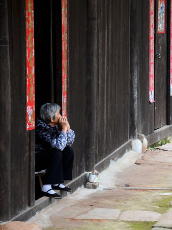 Old woman resting at the old streetのeditorial素材