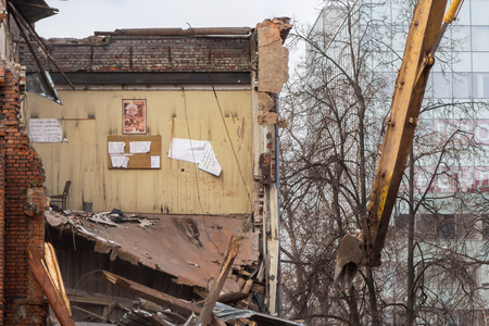 MOSCOW - MARCH 25, 2015: wall of demolished building 205 school named Hero of the Soviet Union Lyutikova with postersのeditorial素材