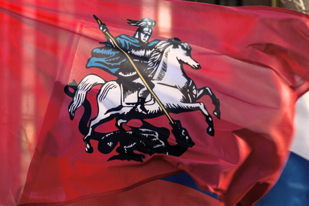 Flags of Moscow and Russia fluttering in the windの写真素材