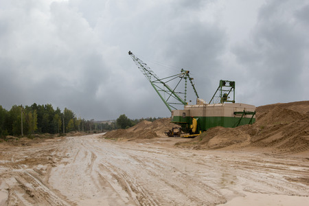 machine on the sand quarry on a rainy day