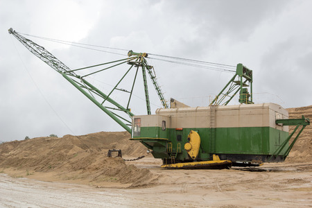machine on the sand quarry on a rainy day