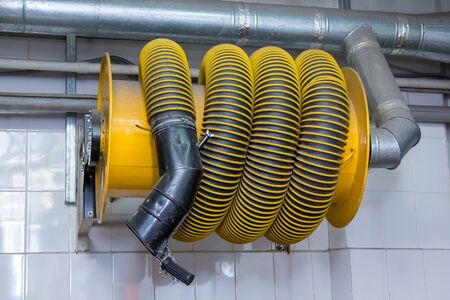 Exhaust gas hose for a truck in the garage