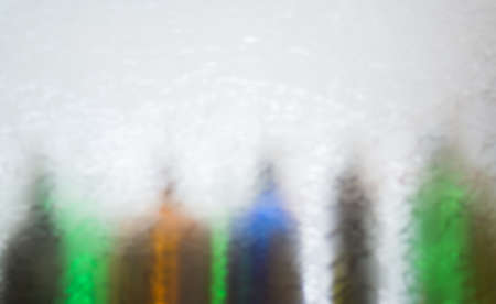 Blurred defocused bottles abstract backgroundの写真素材