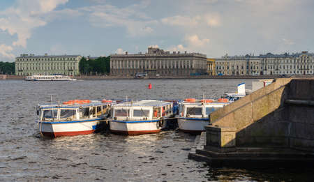 Landscape of Neva river and boats in cloudy day in Saint-Petersburg, Russia.の写真素材