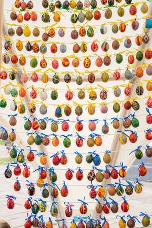 Painted colorful easter eggs on the stringの写真素材