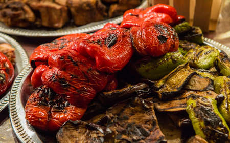 Grilled vegetables with grilled meat at the backgroundの写真素材