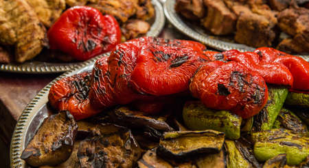 Grilled vegetables with grilled meat at the backgroundの写真素材