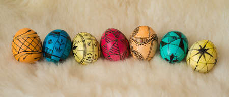 Easter eggs painted in the traditional way lying on sheepÃ¢ï¿½ï¿½s fur.の写真素材