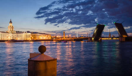 Night cityscape with river and bridge in Saint-Petersburg. Lantern lights on the bridge.の写真素材