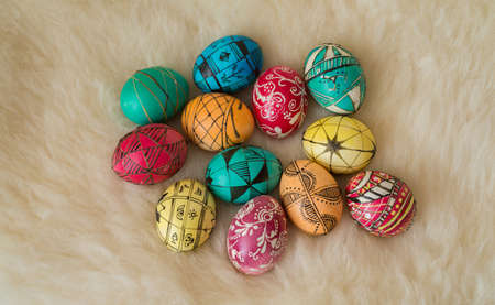 Easter eggs painted in the traditional way lying on sheeps fur.の写真素材