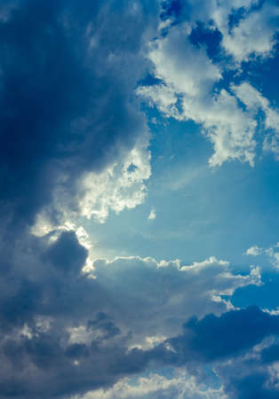 Blue cloudy dramatic sky, summer day.の写真素材