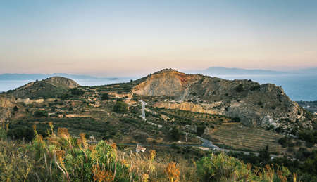 Sunrise view of mountains and sea on Aegina island, Greeceの写真素材