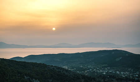 Sunrise view of mountains and sea on Aegina island, Greeceの写真素材