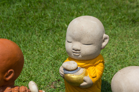 Earthenware of child monk in temple.の写真素材