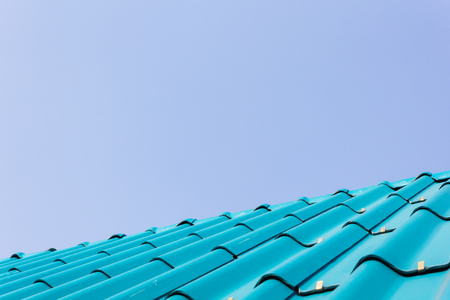 View of blue roof tiles and blue sky background.の写真素材