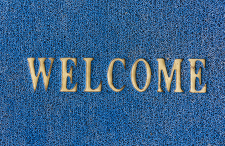 The old doormat of welcome text.の写真素材