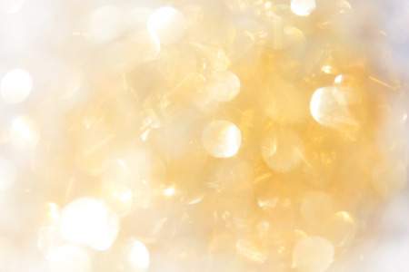 abstract background gold bokeh circles for use background.の写真素材