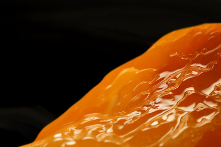 Generative AI Image of Orange Juice Drink Water with Blank Space on Black Backgroundの素材