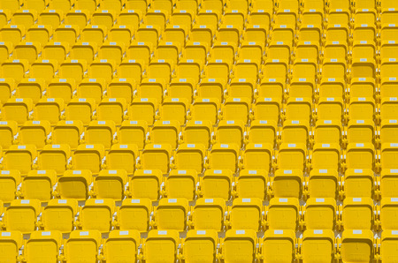 amphitheater of dark yellow seats abstract background perspective rowの写真素材