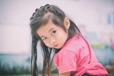 closeup portrait of girl with mouth full of airの写真素材