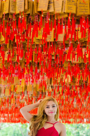 Close-up portrait of young beautiful thai woman, model is an asian beauty on chinese old town street.の写真素材