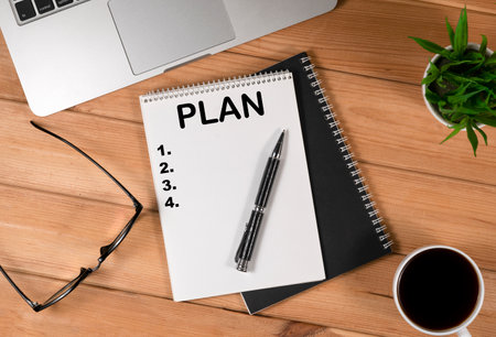 Laptop, Notebook and Office Supply Items on Wooden Work Deskの写真素材