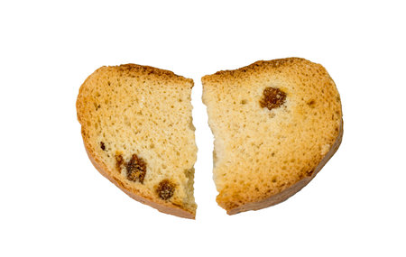 dry broken bread with raisins on a white backgroundの写真素材