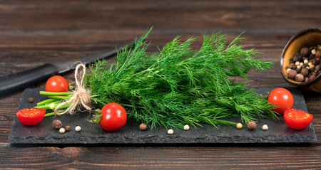 bunch sprinkled with tomatoes on a wooden backgroundの写真素材