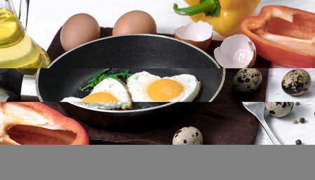 Fried egg in heart shapeの写真素材