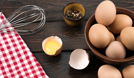 eggs in a clay plate on a wooden background