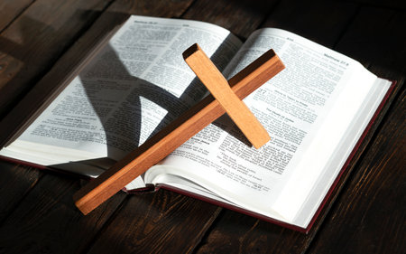 wooden cross and bible on wooden backgroundの写真素材