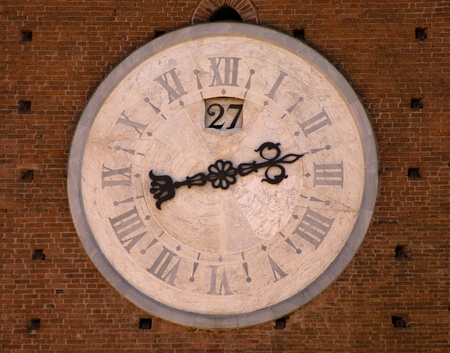Marble clock of a tower in Siena, Tuscany, Italy