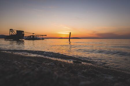 A view of the lake at sunset.の写真素材