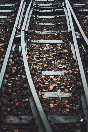 Train tracks between rural towns.