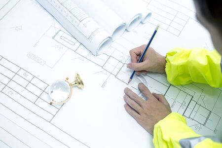 A male engineer is making engineering drawings.の写真素材