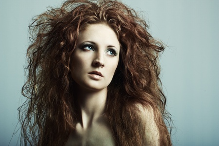 Fashion portrait of a young beautiful redheaded womanの写真素材