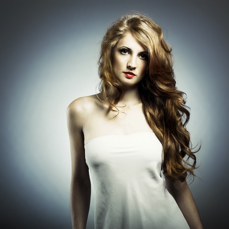 Fashion portrait of young woman in studioの写真素材