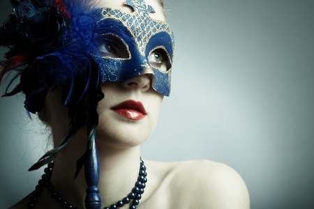 The beautiful young girl in a mysterious maskの写真素材