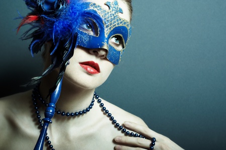 The beautiful young girl in a mysterious maskの写真素材