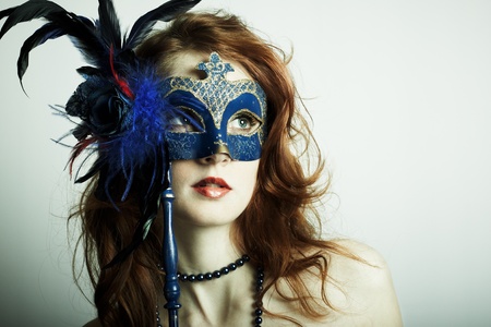 The beautiful young girl in a mysterious maskの写真素材