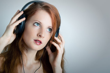 The young girl with headphones