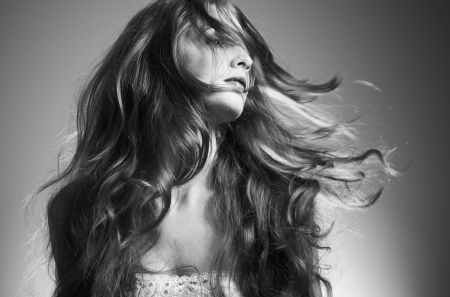 Portrait of the beautiful woman with curly hairの写真素材