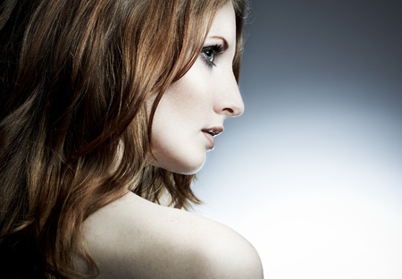 Portrait of the beautiful woman with red curly hairの写真素材