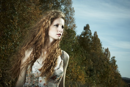 Portrait of the beautiful woman against the skyの写真素材